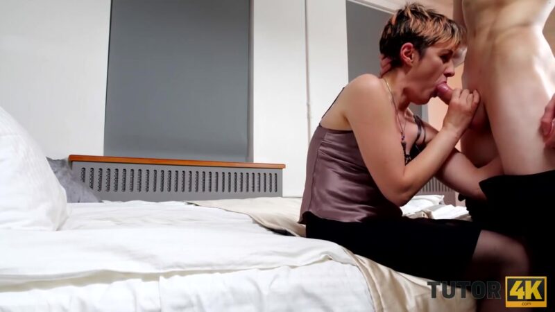 TUTOR4K. MILF wearing official suit makes younger guy go crazy about fucking